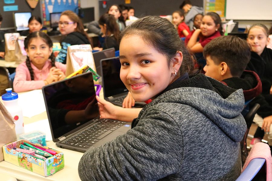  Girl smiling at computer